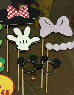 mickey mouse photo booth props on a table