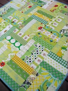 a green and yellow patchwork table runner