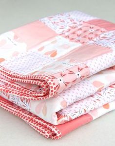 three pieces of fabric stacked on top of each other in pink and white flowers,