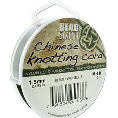 a spool of thread that is white and has black stripes on it, with the words bead smith chinese knotting cord