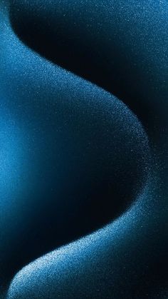an abstract blue background with small white dots on the top and bottom of the image