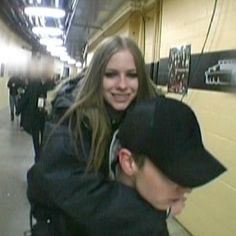 a man is hugging a woman on the subway