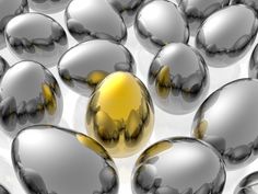 many shiny balls are in the middle of a white surface with yellow highlights on them