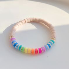 We are litterally OBSESSED with this super cute smiley bracelet set! We also offer the bracelets individually, if that tickles your fancy instead! We love that they are so vertistle and can be worn with just about everything, and can be worn by littles & mamas both! The tightening string on the smiley bracelet will easily adjust to any wrist size comfortably, and the shell rainbow stone has an elastic string that easily adjusts to any size! Grab yours now before they are gone! XOXO BV&C. Smiley Clay Bead Bracelet, Good Vibes Bracelet, Rainbow Clay Bead Bracelet Ideas, Clay Bead Bracelet Ideas Simple, Bracelet Ideas Colors, Friendship Bracelet Sets, Clay Bead Bracelet Ideas Smiley Face, Flat Bead Bracelet Ideas Summer, Easy Clay Bead Bracelet Ideas