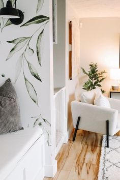 a living room filled with furniture and a flat screen tv mounted to the side of a wall