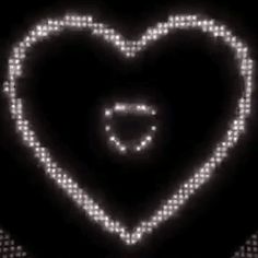 a heart shaped object is shown in the dark