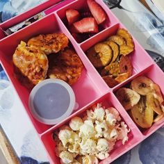 a pink tray filled with different types of food