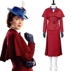 a woman wearing a red coat and hat with polka dots on it, next to a mannequin