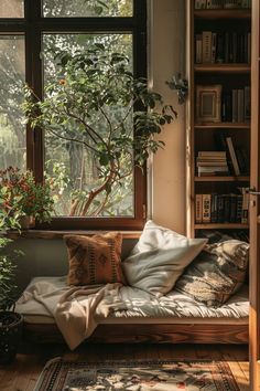 a living room filled with lots of furniture and bookshelves next to a window