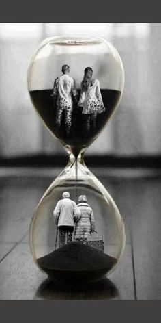 an hourglass with two people in it