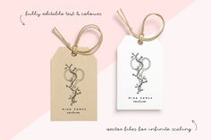 two tags with floral designs on them hanging from twine strings against a pink and white background