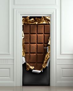 an open door that has some foil on it and is in the shape of a chocolate bar