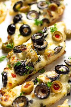 a close up of sliced pizza with olives on it and the text overlay reads quick and easy olive cheese bread