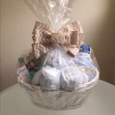 a basket filled with baby items on top of a table