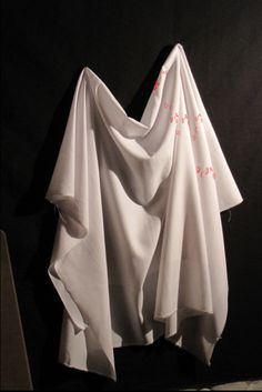 a white piece of cloth hanging on the wall