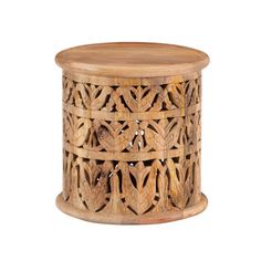 a wooden stool with intricate carvings on it