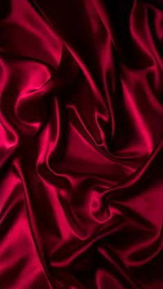 a close up view of a red satin fabric with very high resolution and grainy texture