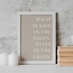 a white framed poster with the words what is said in the salon, stays in the salon