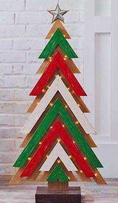 a wooden christmas tree with lights on it