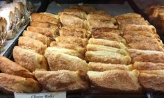 many different types of breads in a display case