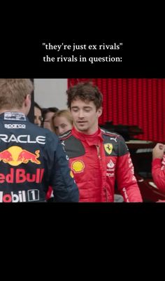 two men standing next to each other in front of a red bull sign with the words, they're just ex rivals