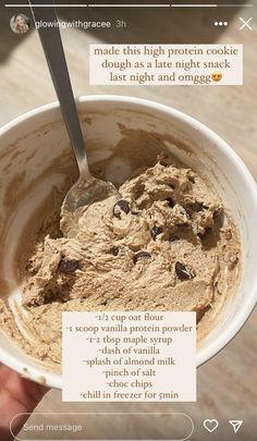 someone is holding a bowl of peanut butter and chocolate chip cookie dough with a spoon in it