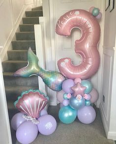 mermaid balloons and under the sea decorations on stairs