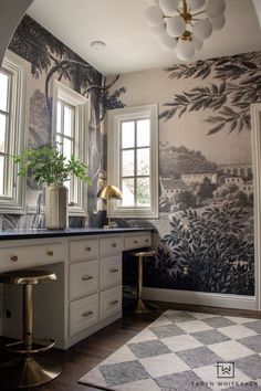 a bathroom with a checkered floor and wallpaper on the walls is pictured in this image