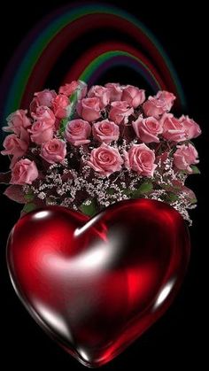 a heart - shaped vase filled with pink roses sits in front of a rainbow colored background