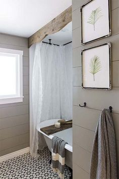 the bathroom is decorated in white and gray