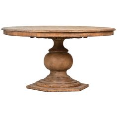 an old wooden table with a round base and pedestals on the top, against a white background