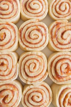 freshly made cinnamon rolls on a baking sheet ready to be baked in the oven for breakfast