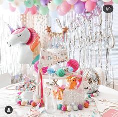 a unicorn themed birthday party with balloons and decorations