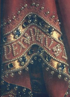 a close up view of the beaded and sequins on an old dress