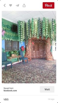 a room decorated with paper flowers and trees