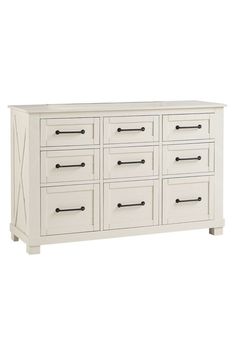 a white dresser with many drawers and handles on it's sides, against a white background