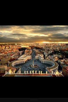 an aerial view of the city and its surrounding buildings at sunset or sunrise, taken from the top of st peter's square