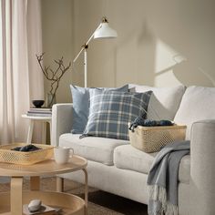 a living room filled with furniture and pillows