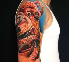 an octopus tattoo on the left arm and shoulder is painted in bright colors with black dots