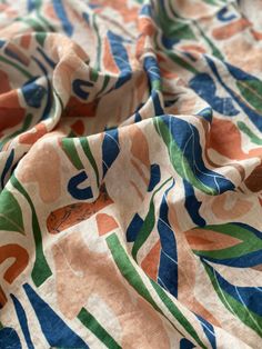 an orange, blue and green floral print fabric