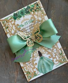 a close up of a greeting card with a green bow on it's side