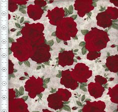 red roses on white fabric with green leaves