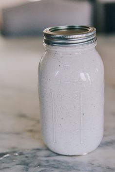 a mason jar sitting on top of a marble counter