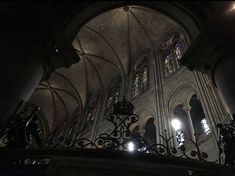 the inside of a cathedral with stained glass windows