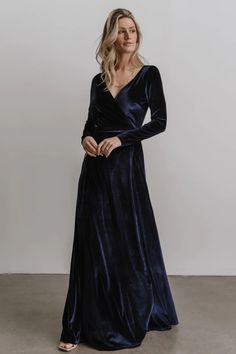 This eye catching emerald velvet maxi dress is a show stopper! The full length skirt and sleeves are made out of incredibly soft material with a true wrap dress style. Navy Blue Long Sleeve Bridesmaid Dresses, Navy Bridesmaid Dress, Navy Blue Velvet Dress, Navy Velvet Dress, Turquoise Maxi Dress, Emerald Velvet, Wrap Dress Styles, Long Sleeve Bridesmaid Dress, Velvet Bridesmaid Dresses
