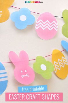 an easter bunting banner with paper cut outs on it and the words free printable easter