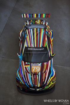 a colorful sports car parked in a parking lot