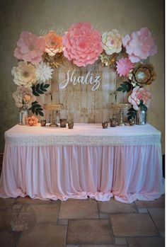 a table with flowers and candles on it