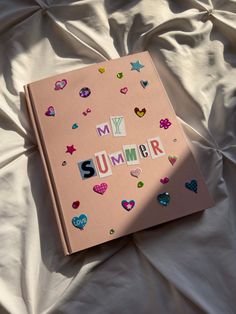 a pink book with the word summer written on it