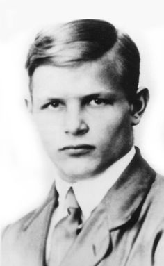 an old black and white photo of a young man